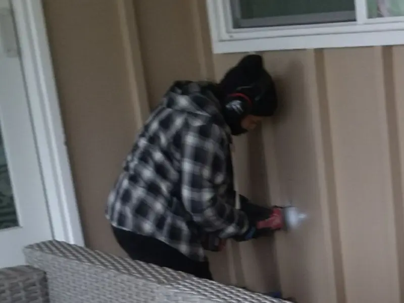Professional electrician installing an exterior outlet in Garrett