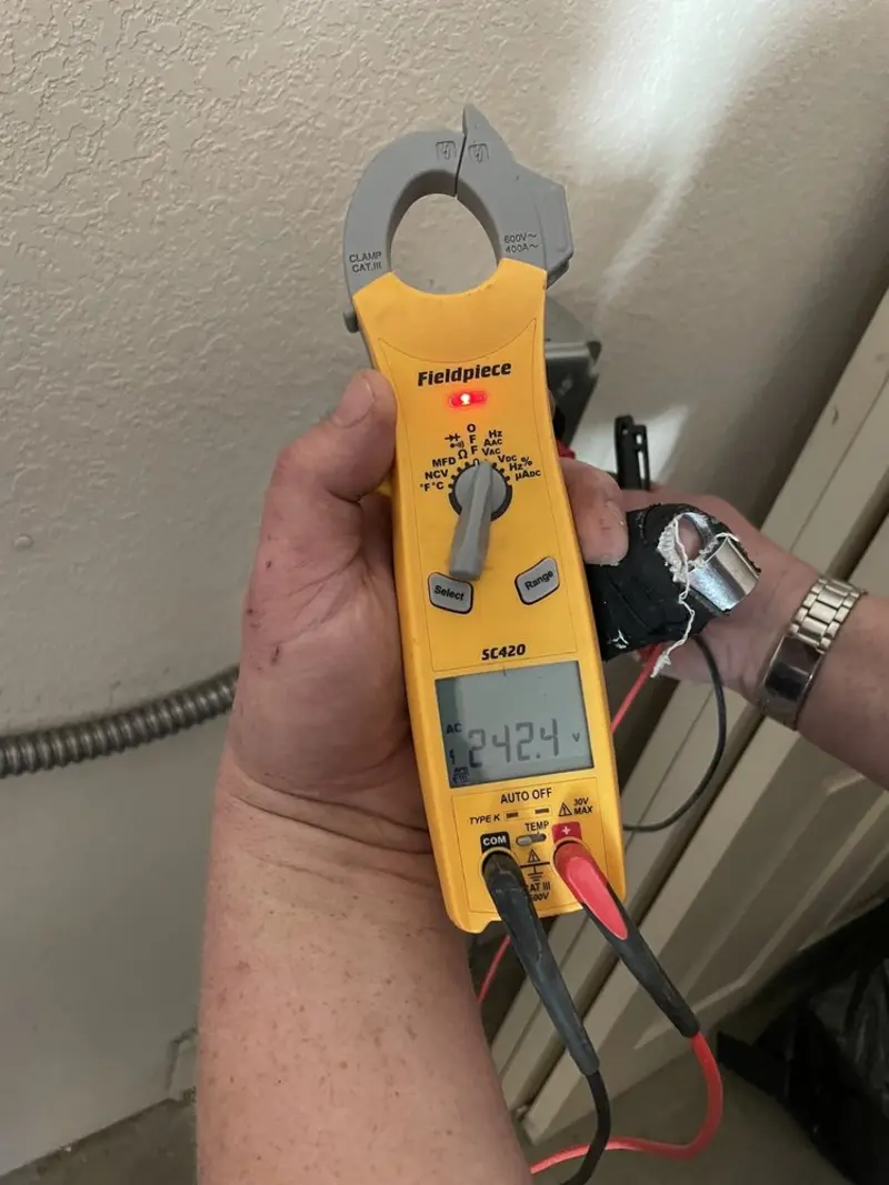 Voltage testing with clamp meter during Hot Tub / Pool Electrical Wiring in Garrett